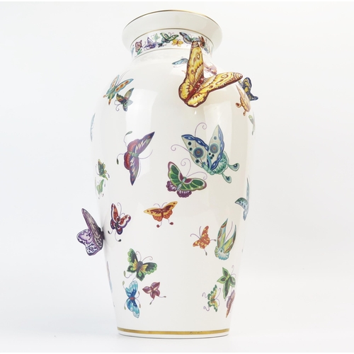 1357 - A Franklin Mint porcelain vase, decorated with painted and applied butterflies, 30cm high.