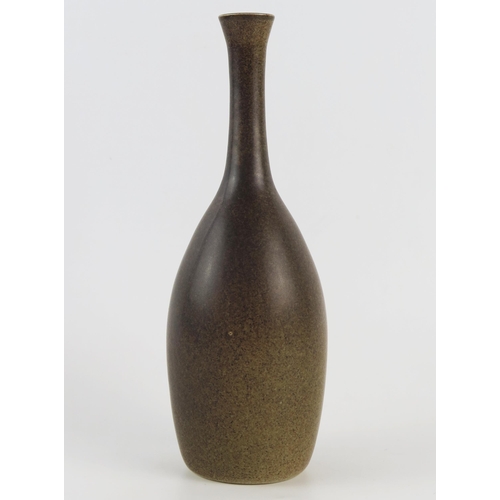 1423 - A Korean pottery vase, of slender ovoid form, with brown mottled glaze, incised character to the bas... 