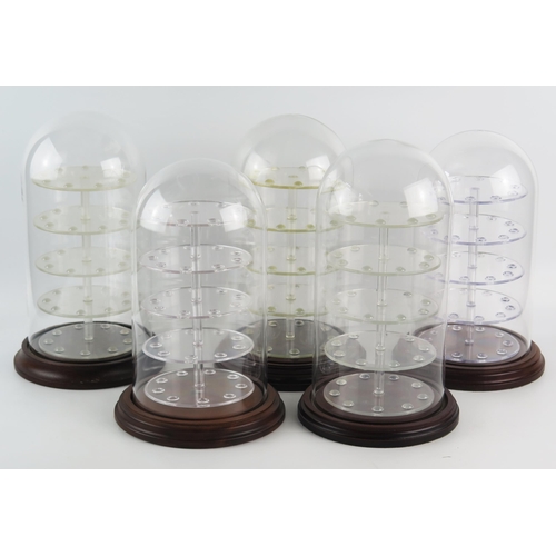 1481 - Five assorted glass and Perspex display domes, on turned and polished wood bases, each 30cm high.