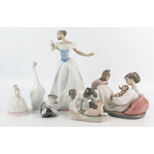 1373 - A collection of Lladro porcelain figurines and animals, including a mother and children, a ballet da... 