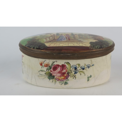 1572 - A 19th century Staffordshire enamel oval box, the hinged lid decorated with a view of an figures in ... 