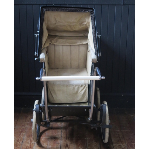 1650 - Treasure Cot Co. London, an early 20th century painted wood and canvas pram,  with black and lined c... 