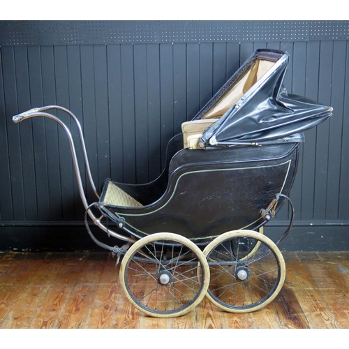 1650 - Treasure Cot Co. London, an early 20th century painted wood and canvas pram,  with black and lined c... 