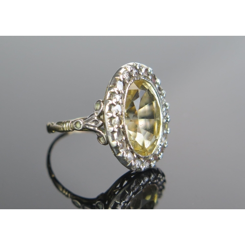 128 - A Citrine and Rose Cut Diamond Ring in an unmarked precious yellow and white metal and setting, 14x1... 