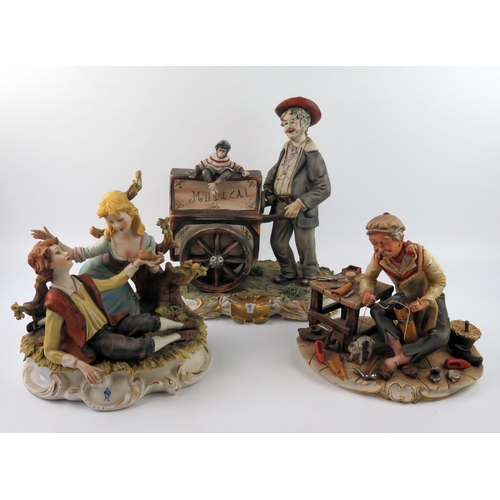 1302A - Three Capo di Monte figure groups, The Organ Grinder, The Cobbler, and Young lovers. (3)