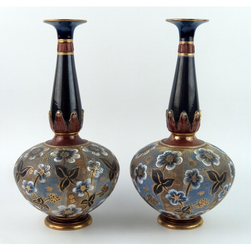 1313 - A pair of Royal Doulton Slater pottery vases, of squat circular form with slender necks with flowerh... 