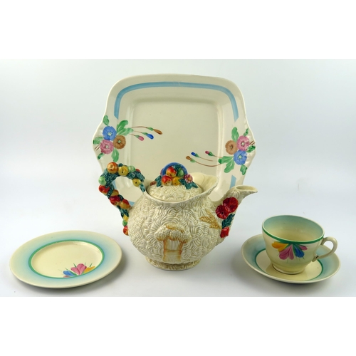 1317 - Clarice Cliff a pottery sandwich plate, with floral painted decoration, a teacup , saucer and matchi... 