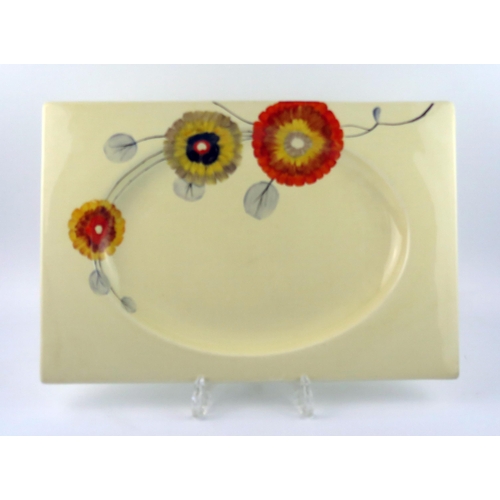 1319 - A Clarice Cliff Bizarre ware pottery rectangular platter, depicting polychrome abstract daisies, 40c... 