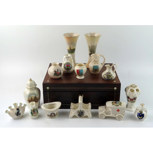 1339 - A small collection of crested china wares, including vases, hatpin holder, urns etc contained in a r... 