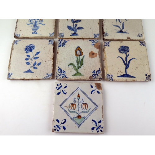 1346 - Seven Dutch Delft blue and white tiles depicting flowers and floral sprays,