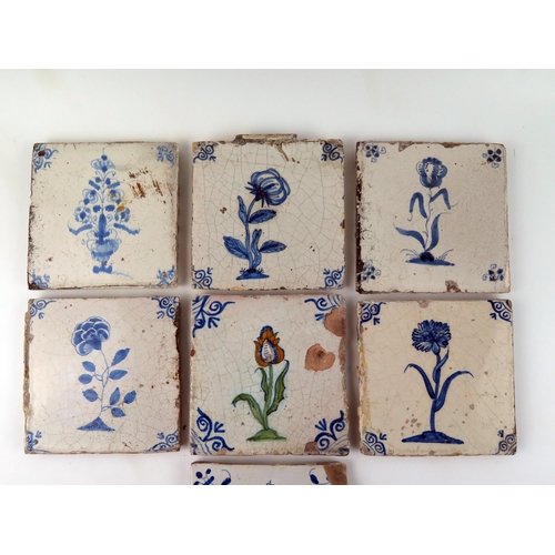 1346 - Seven Dutch Delft blue and white tiles depicting flowers and floral sprays,