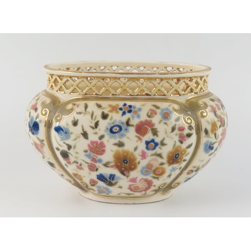 1355 - A Zsolnay Pecs oval posy vase, with pierced rim, the body of lobed oval form, decorated with floral ... 