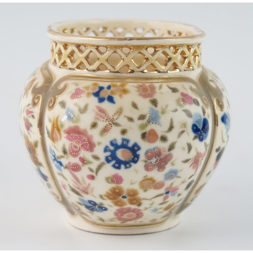 1355 - A Zsolnay Pecs oval posy vase, with pierced rim, the body of lobed oval form, decorated with floral ... 