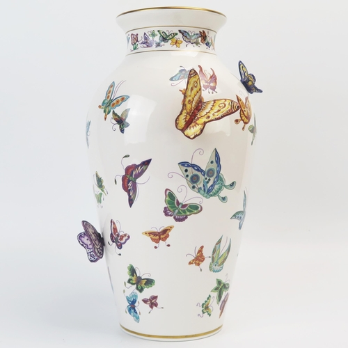 1357 - A Franklin Mint porcelain vase, decorated with painted and applied butterflies, 30cm high.