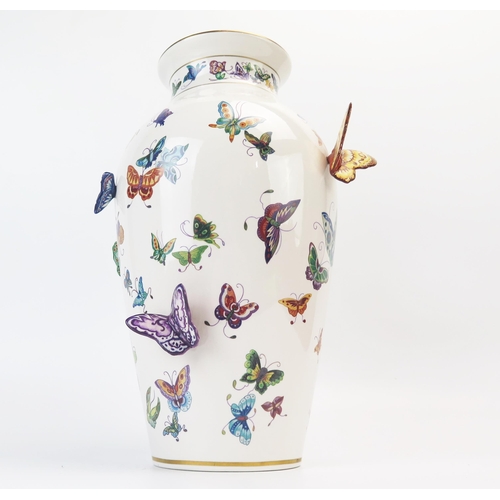 1357 - A Franklin Mint porcelain vase, decorated with painted and applied butterflies, 30cm high.