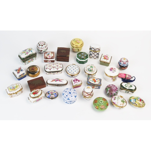 1374 - A collection of porcelain and gilt metal mounted pill boxes, patch box, glass paperweight, necessair... 