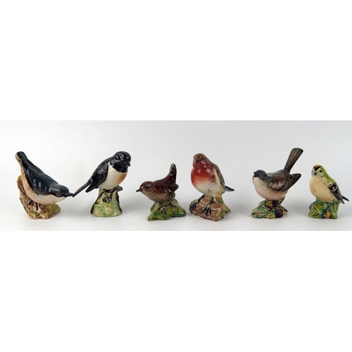 1377 - Six Beswick bird figurines, with black backstamps, includes, Wren, Goldcrest, Robin, Whitethroat, Nu... 