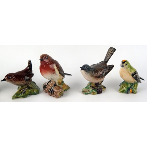 1377 - Six Beswick bird figurines, with black backstamps, includes, Wren, Goldcrest, Robin, Whitethroat, Nu... 