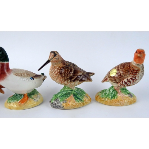 1380 - Four assorted Beswick pottery bird ornaments, includes Owl, Mallard Duck, Snipe and partridge, (4).