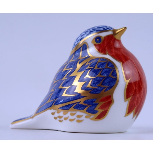 1398 - A Royal Crown Derby bird figurine, decorated in the Imari palette, 9cm long.