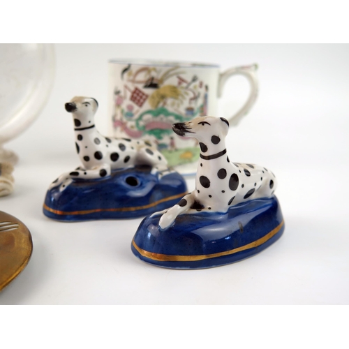 1400 - A continental porcelain cabinet cup and saucer, a pair of pottery Dalmatian dogs, 8cm long a similar... 