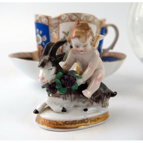 1400 - A continental porcelain cabinet cup and saucer, a pair of pottery Dalmatian dogs, 8cm long a similar... 