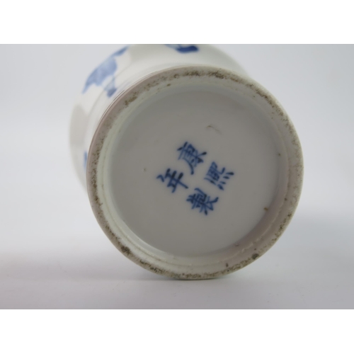 1416 - A Chinese blue and white vase of 'Gu' form, decorated with warriors and standard bearer, bears four ... 