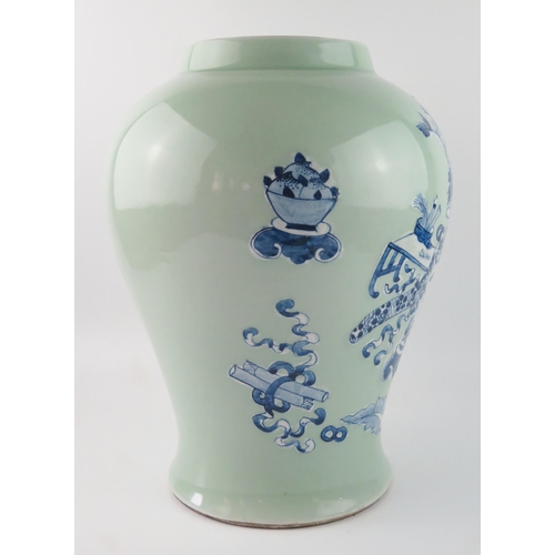 1421 - A Chinese vase of ovoid form, with blue and white auspicious objects to a green celadon ground, 37cm... 