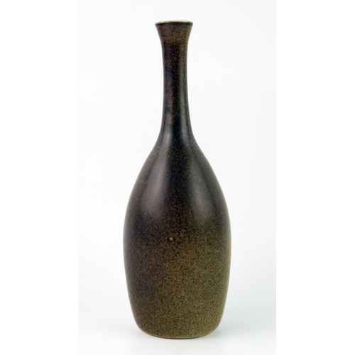 1423 - A Korean pottery vase, of slender ovoid form, with brown mottled glaze, incised character to the bas... 