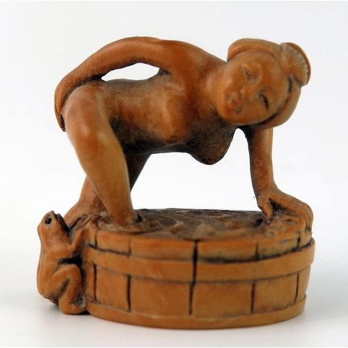 1429 - A Japanese carved Boxwood erotic netsuke of a female taking a bath, 4cm wide.