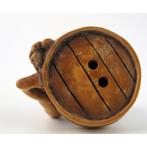 1429 - A Japanese carved Boxwood erotic netsuke of a female taking a bath, 4cm wide.