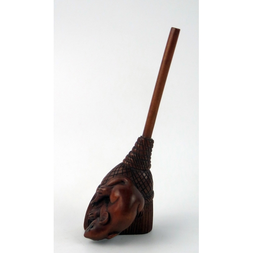 1430 - A Japanese carved boxwood netsuke of a rat on a broom, unsigned, 9cm long.