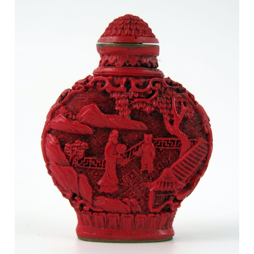 1433 - A Chinese faux cinnabar lacquer scent bottle, of moon-shaped outline decorated with figures in a pag... 