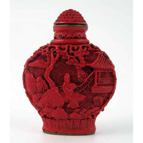 1433 - A Chinese faux cinnabar lacquer scent bottle, of moon-shaped outline decorated with figures in a pag... 