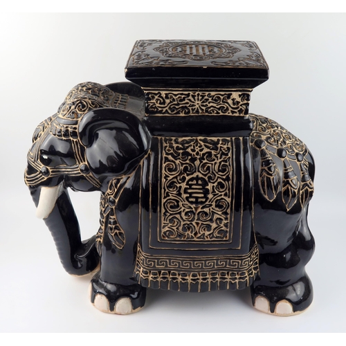 1437A - A large modern Chinese pottery jardinière stand in the form of elephant, with polychrome decoration,... 