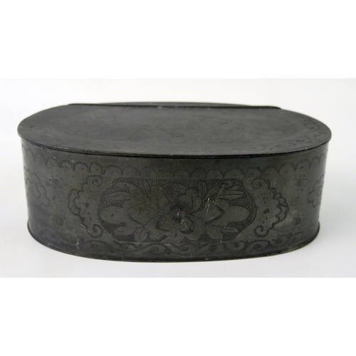 1439 - A Chinese pewter oval box, with hinged lid enclosing a compartments interior, with floral decoration... 