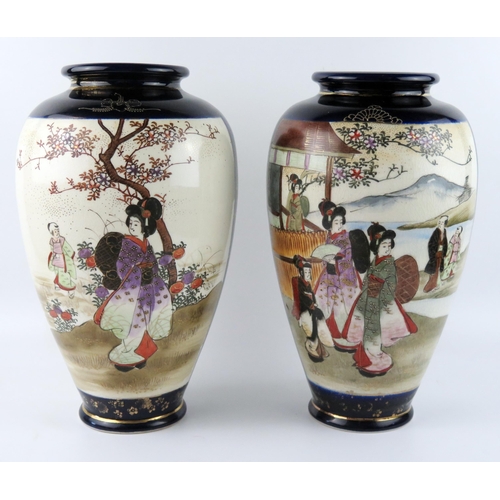 1440 - A large pair of Japanese vases of ovoid form, decorated with panels depicting figures in garden land... 