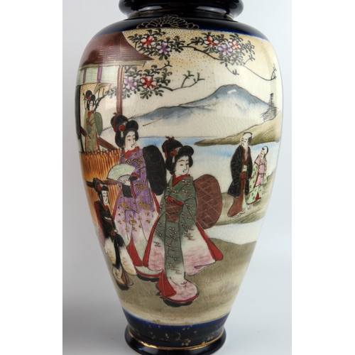 1440 - A large pair of Japanese vases of ovoid form, decorated with panels depicting figures in garden land... 