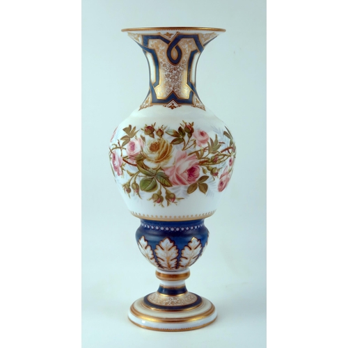 1483 - A late Victorian white glass vase of ovoid form, with flared rim, decorated with briar roses, on a k... 