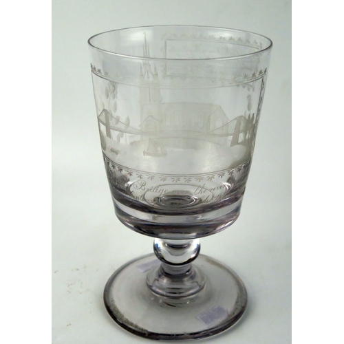 1492 - A 19th century large lead glass rummer, with etched decoration of the suspension bridge over the riv... 