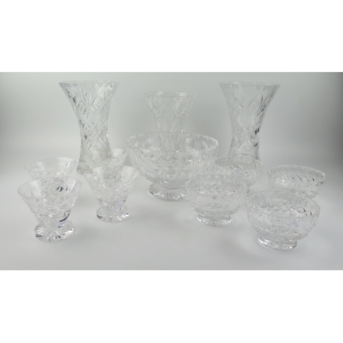 1493 - Three cut glass vases of waisted form, a fruit bowl and assorted sundae dishes.