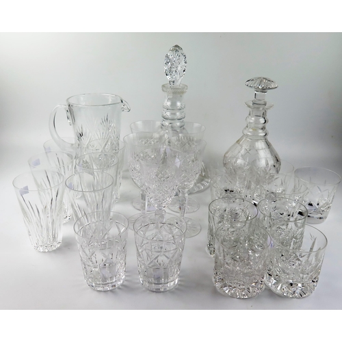 1494 - A cut glass mallet decanter with triple ring neck, a ships decanted, a cordial jug together with ass... 