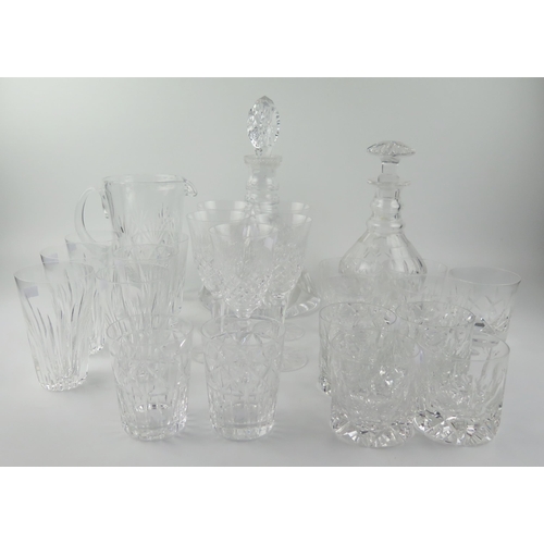 1494 - A cut glass mallet decanter with triple ring neck, a ships decanted, a cordial jug together with ass... 