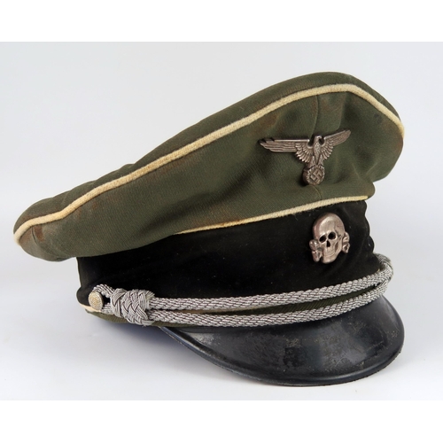 1528 - A Third Reich museum piece SS officer's peak cap, with totenkopf and national emblem badges attached... 