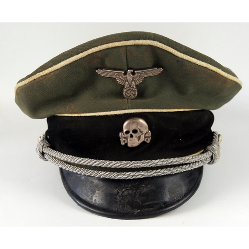 1528 - A Third Reich museum piece SS officer's peak cap, with totenkopf and national emblem badges attached... 