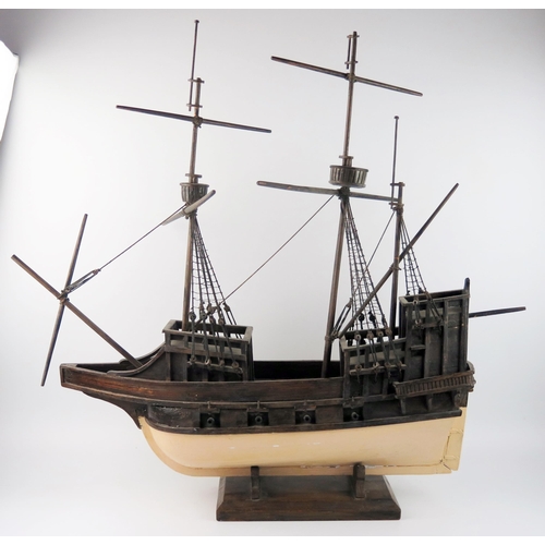 1550 - A wooden model of a two mast galleon, with painted hull, eight cannons, partially rigged, 72cm long.