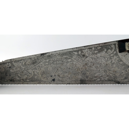 1560 - A miniature saw by Beardshaw & Son, Sheffield, inscribed with etched foliate decoration, 29cm long.