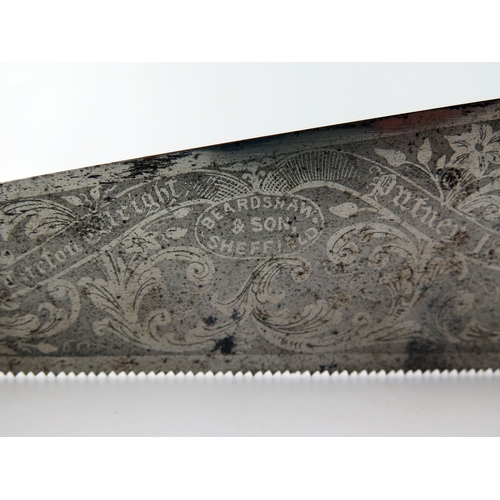 1560 - A miniature saw by Beardshaw & Son, Sheffield, inscribed with etched foliate decoration, 29cm long.