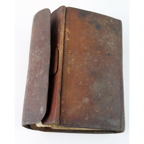 1593 - Hardy Brothers Alnwick, a leather cast and fly wallet, containing assorted casts, salmon and sea tro... 