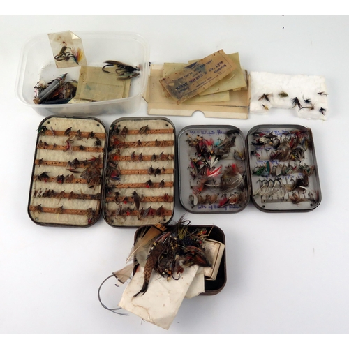 1594 - A collection of assorted salmon, sea  trout ant trout flies, contained in fly boxes and loose.